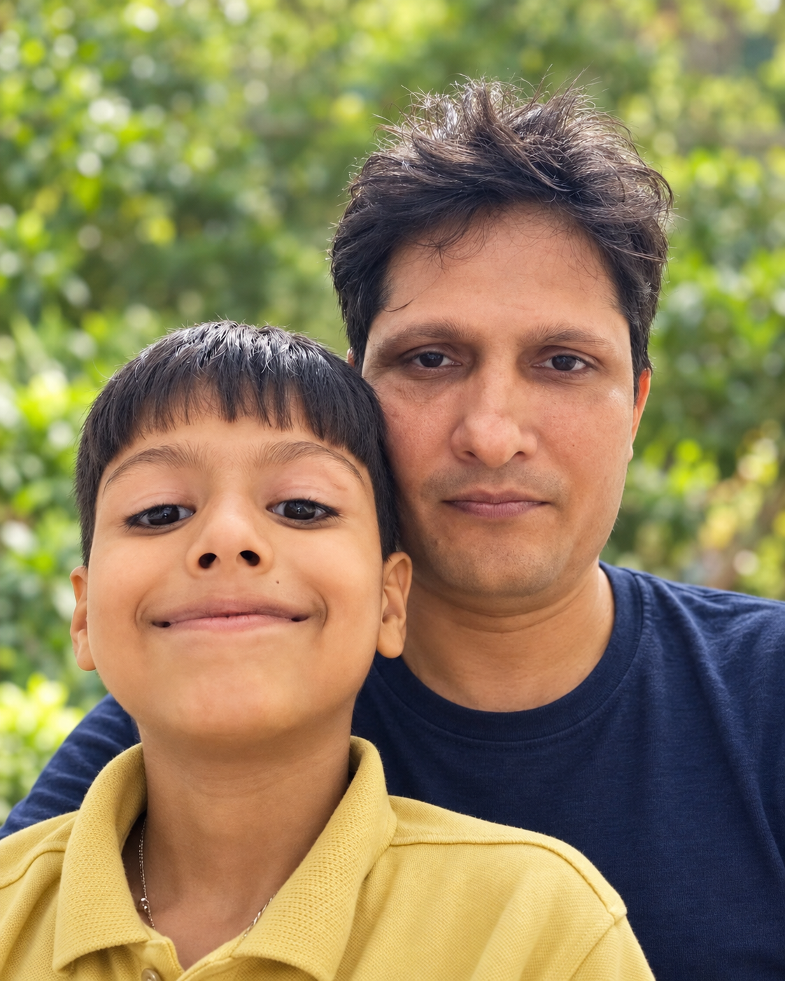 Arvind Mishra with his son in a relaxed family portrait